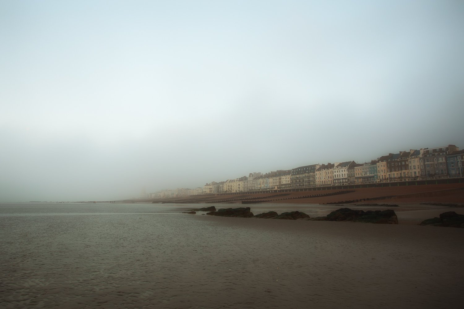 Cyclist emerging from shade on pretty country lane